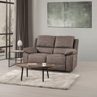 Gray sofa in a living room with a coffee table and abstract painting on the wall.