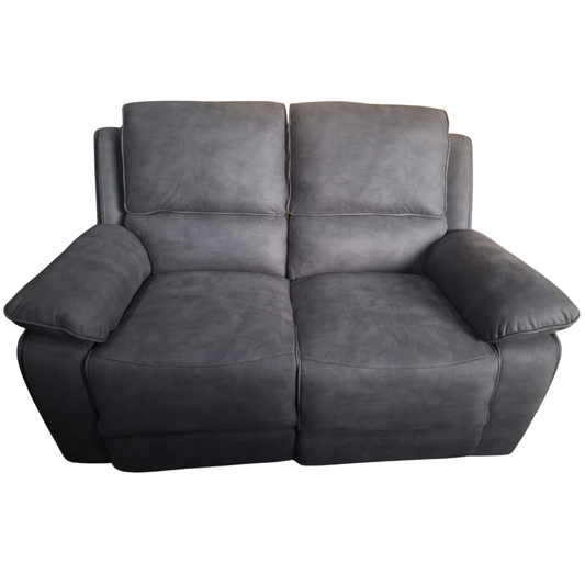 A dark gray two-seater reclining loveseat sofa with plush padded armrests and backrests, shown against a plain white background.