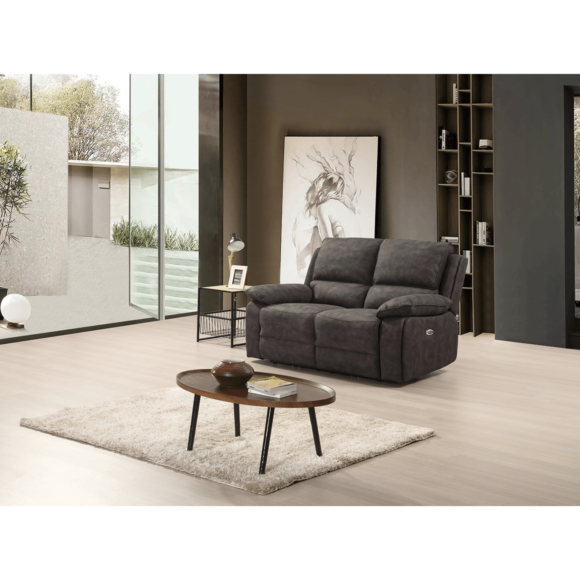 Gray sofa in a modern living room with a coffee table and decor items.