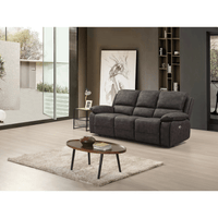 Gray sofa in a modern living room with a coffee table and decorative items.