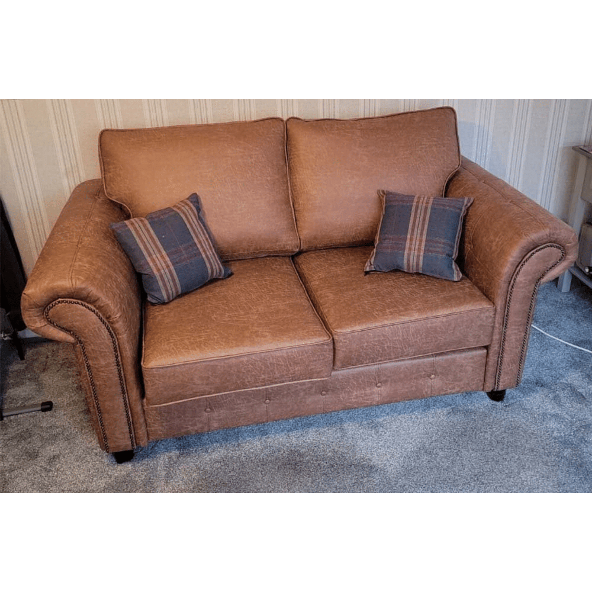 Oakland tan 2-seater sofa with plush cushions and modern design, displayed in a stylish living room setting