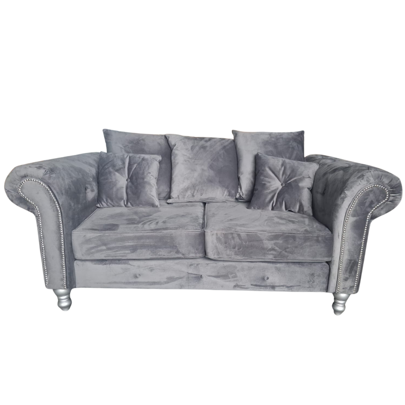 grey velvet 2 seater on a white background