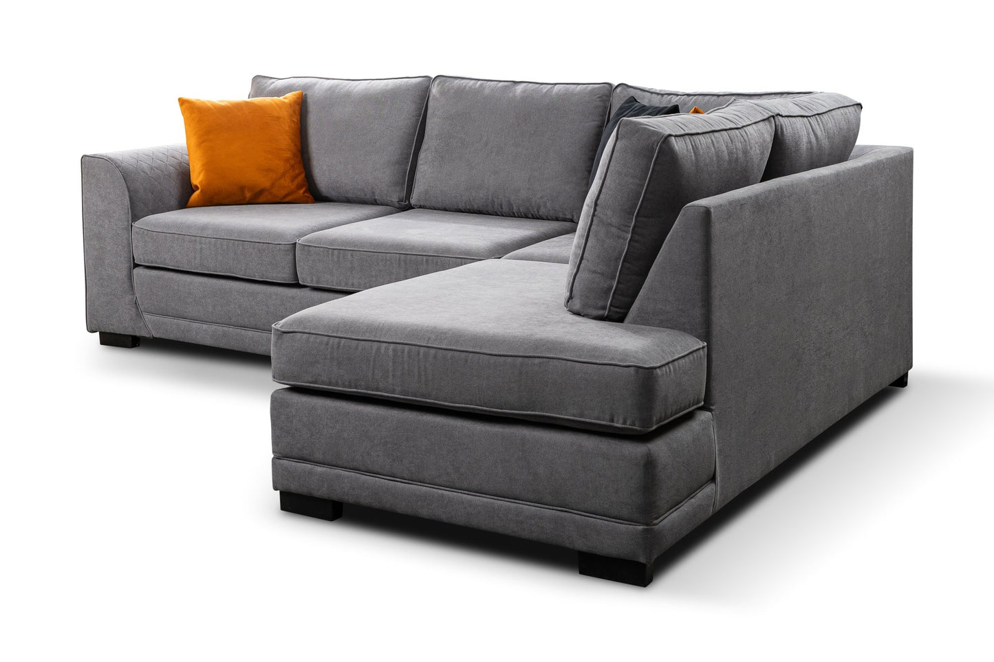 Okra Gray sectional sofa with an orange pillow on a white background