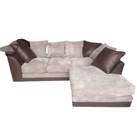 Sectional sofa with brown and beige cushions on a white background
