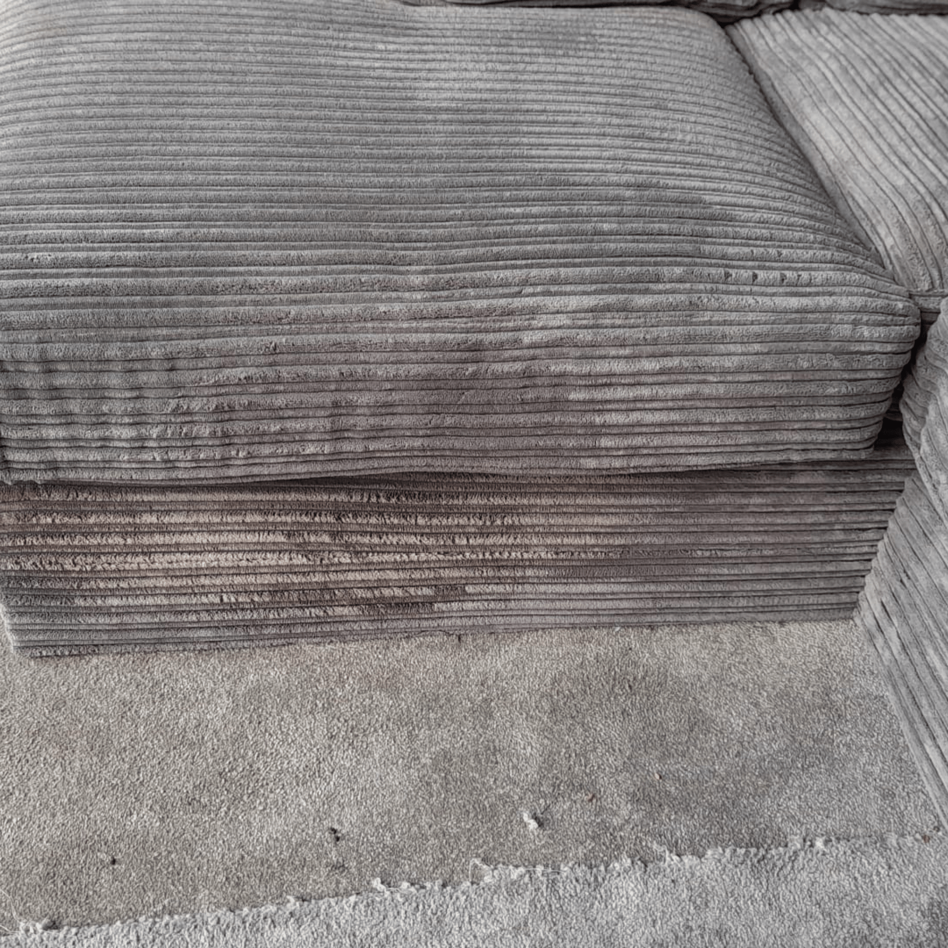 Close-up of a textured gray fabric surface