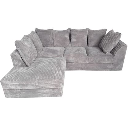 Gray sectional sofa with multiple cushions on a white background