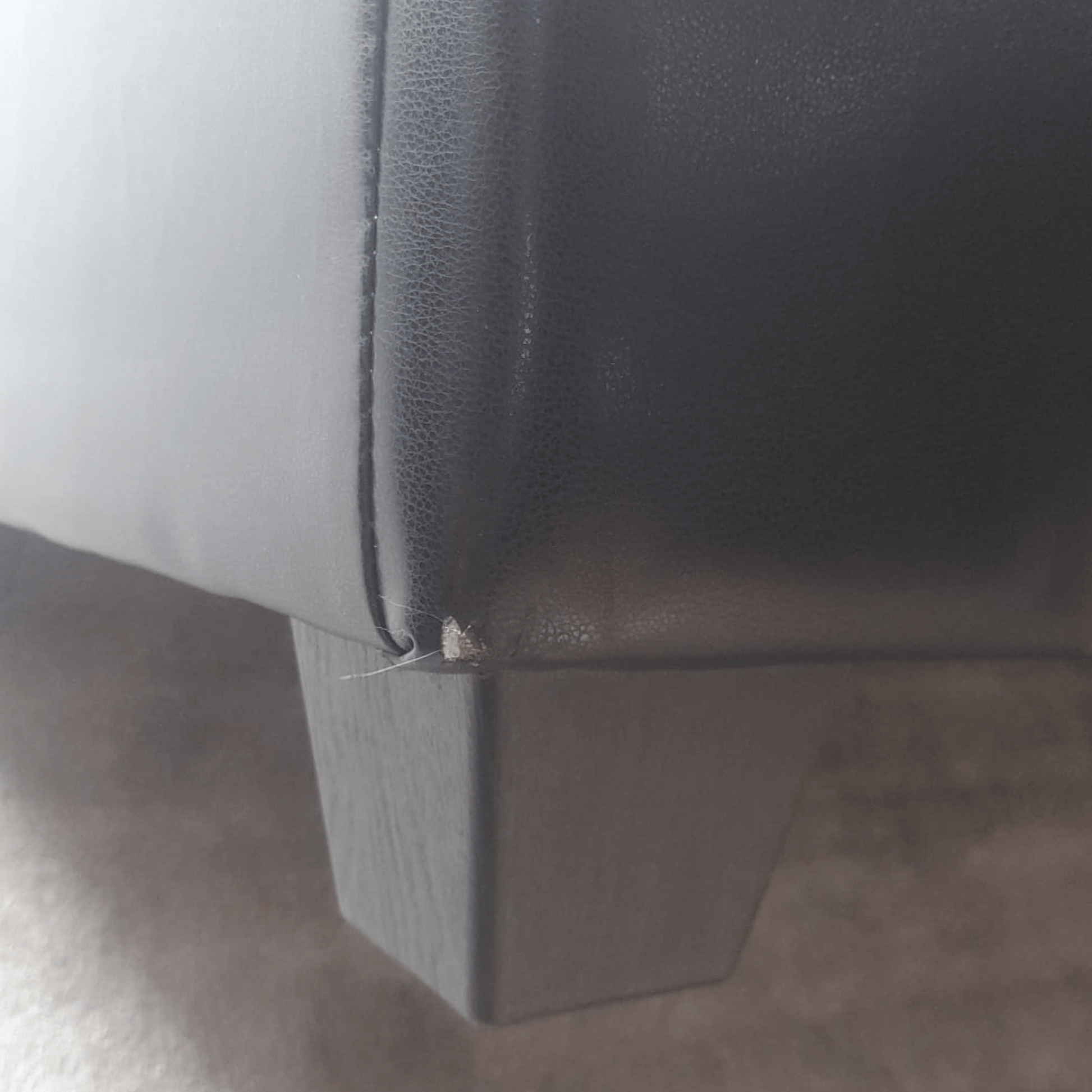 Close-up of a gray car seat with a visible seam.