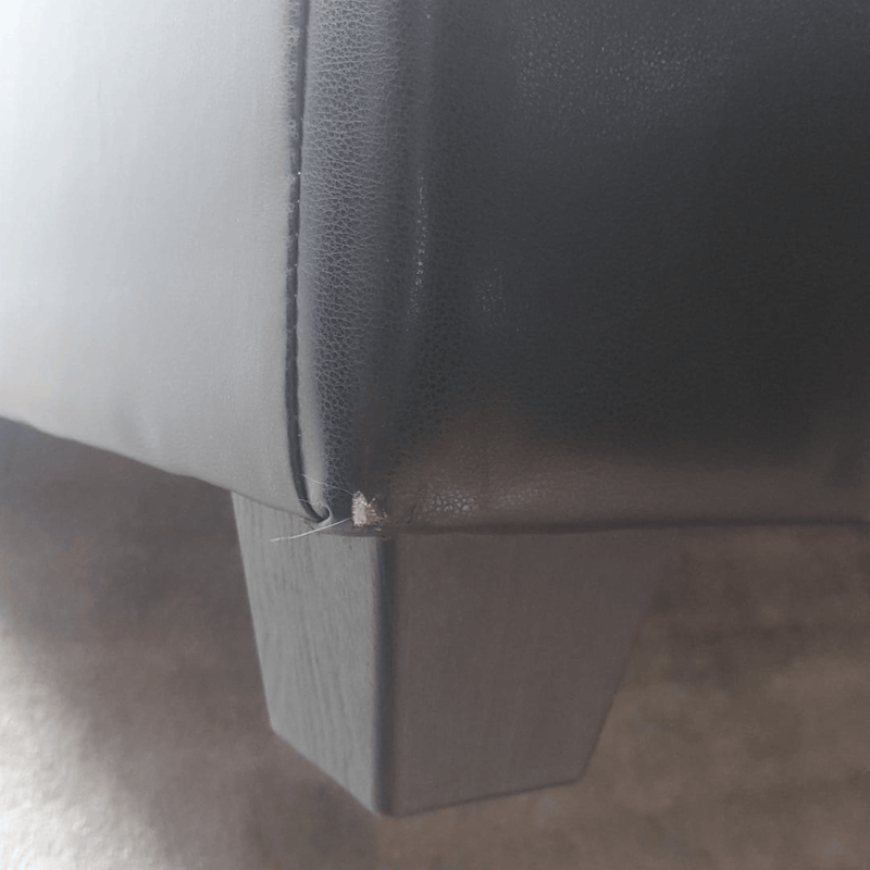 Close-up of a gray car seat with a visible seam.