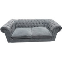 Gray velvet sofa on a white background