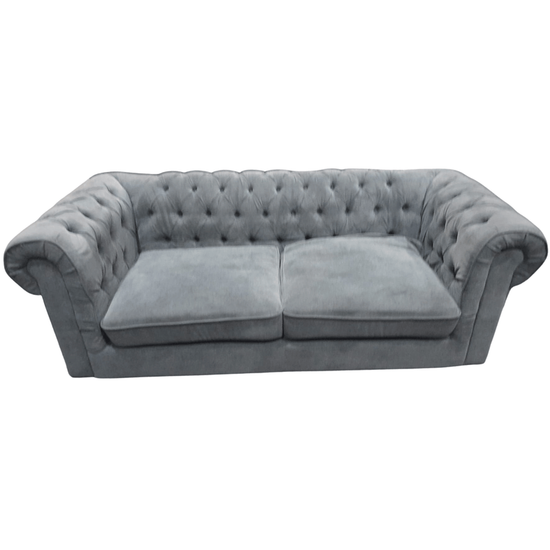 Gray velvet sofa on a white background