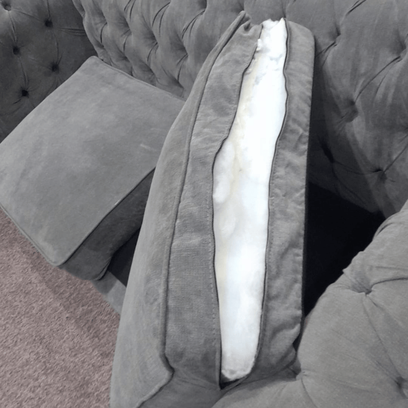 Gray sofa with a visible cushion and seat structure.