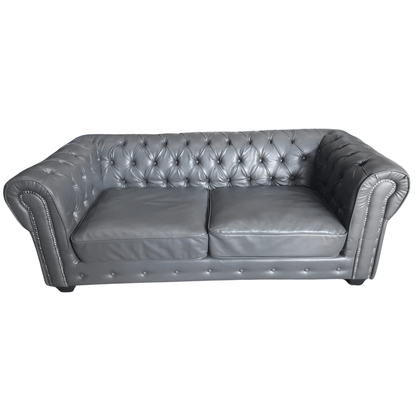 Gray tufted leather sofa on a white background