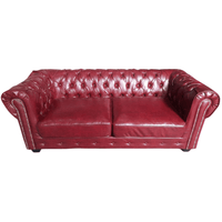 Red leather sofa on a white background