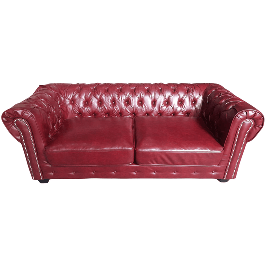 Red leather sofa on a white background
