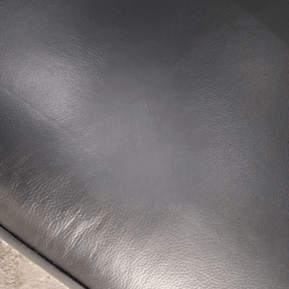 Close-up of dark gray leather surface
