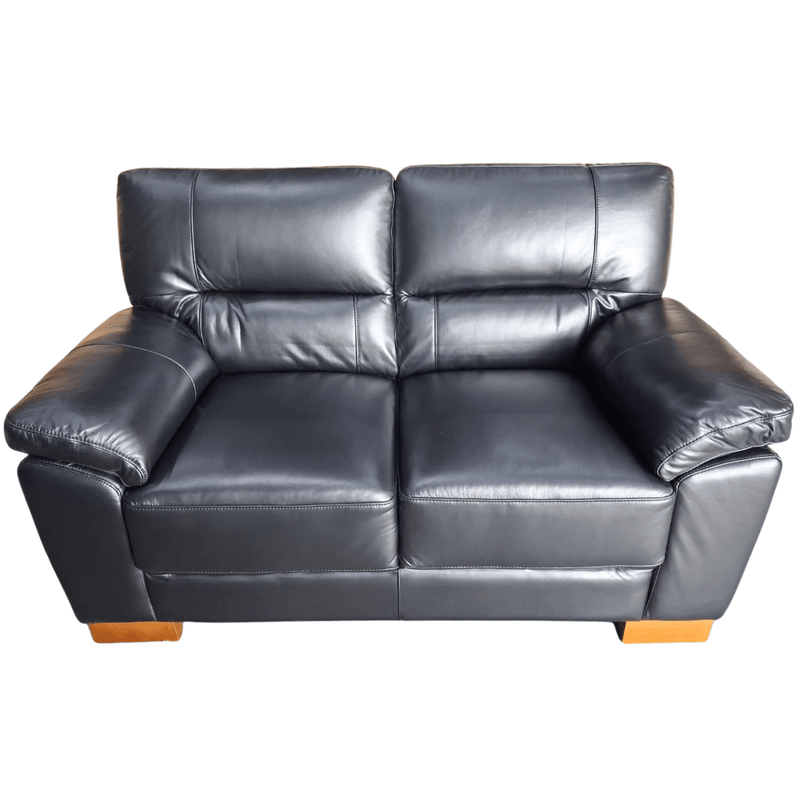 Gray leather sofa on a white background