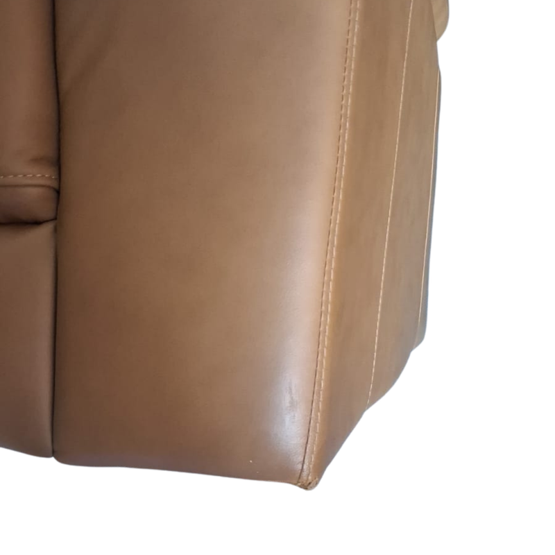 Close-up of a brown leather chair corner on a white background
