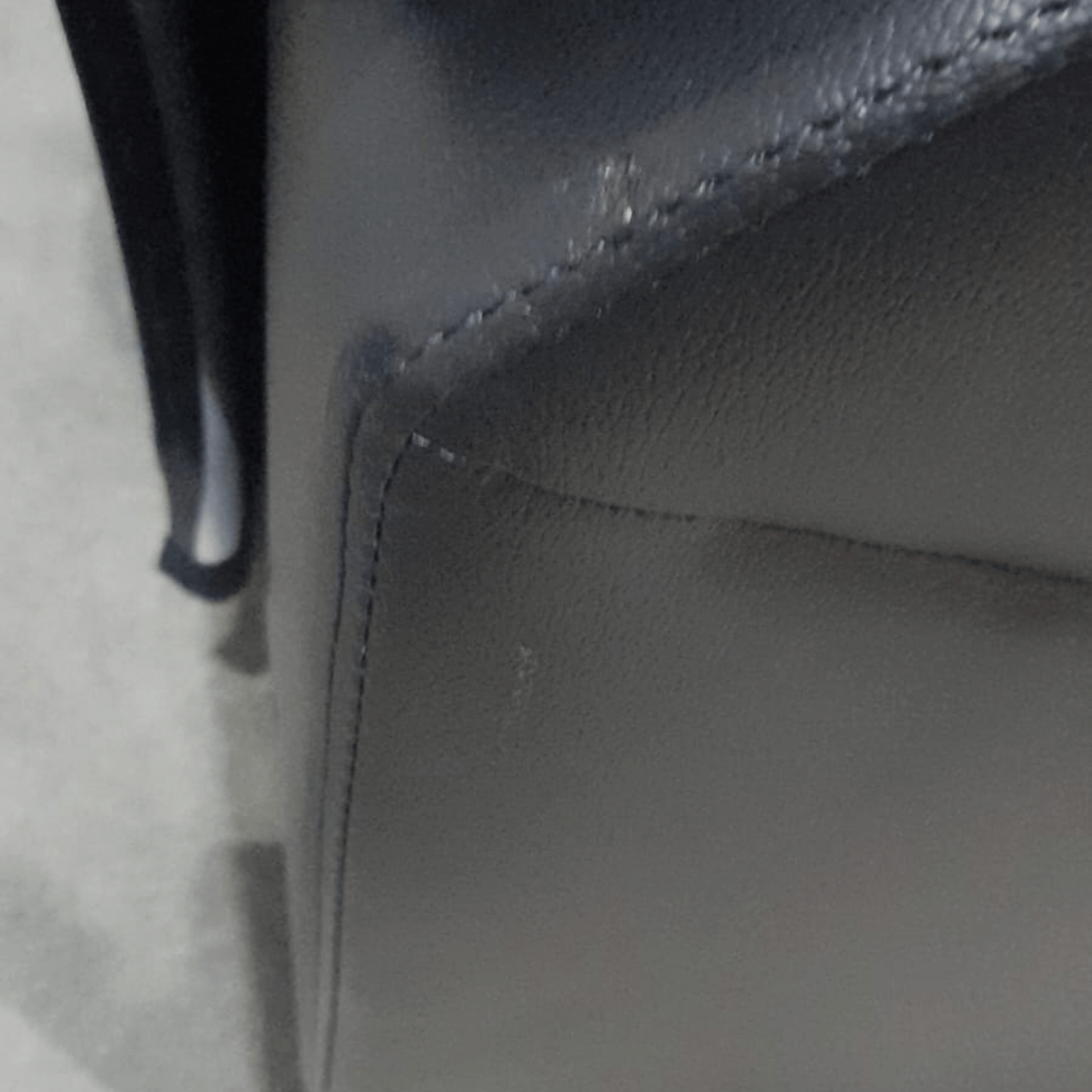 close up of marks on black leather sofa