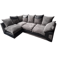 Gray sectional sofa with black accents on a white background