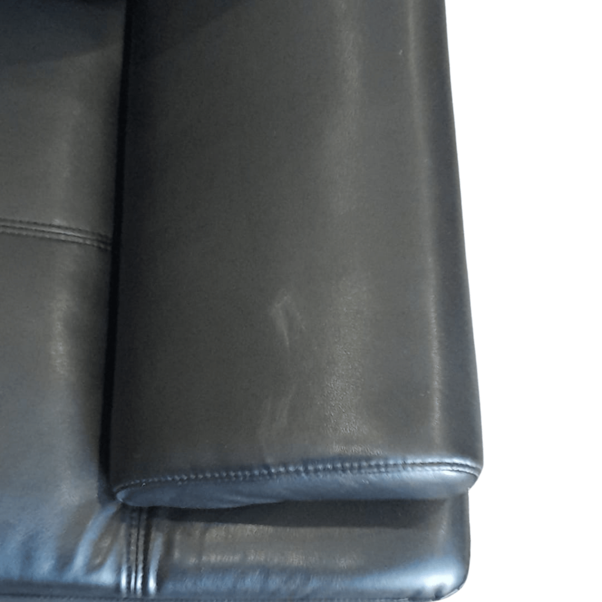 close up of black leather sofa arm