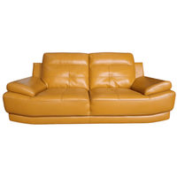 Yellow leather sofa on a white background