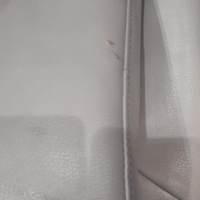 Close-up of a textured gray surface with a zipper