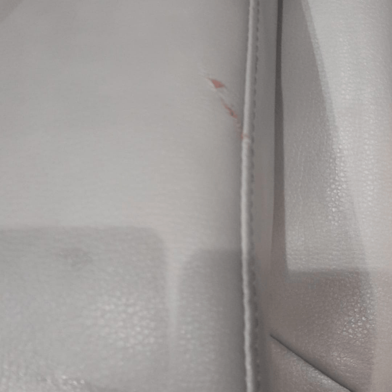 Close-up of a textured gray surface with a zipper