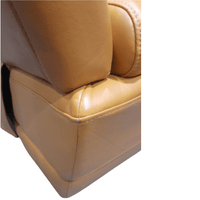 Close-up of a beige leather car seat with a white background