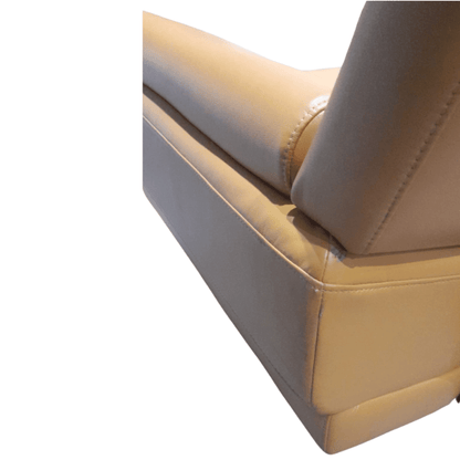 Close-up of a Yellow leather armchair with stitching details on a white background