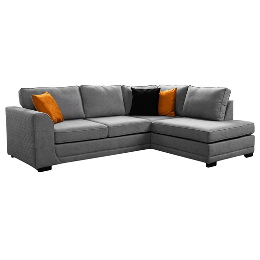 Gray sectional sofa with orange and black cushions on a white background