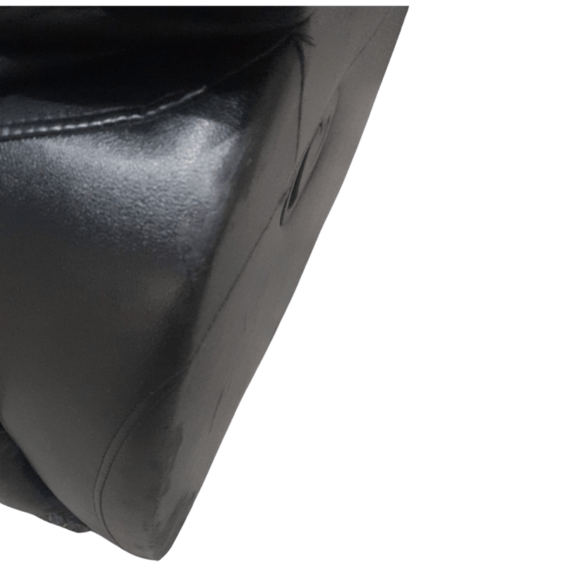 close up of black leather 3 seater sofa 