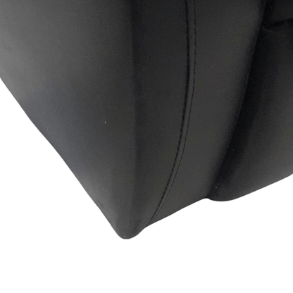 close up of black leather 3 seater sofa 