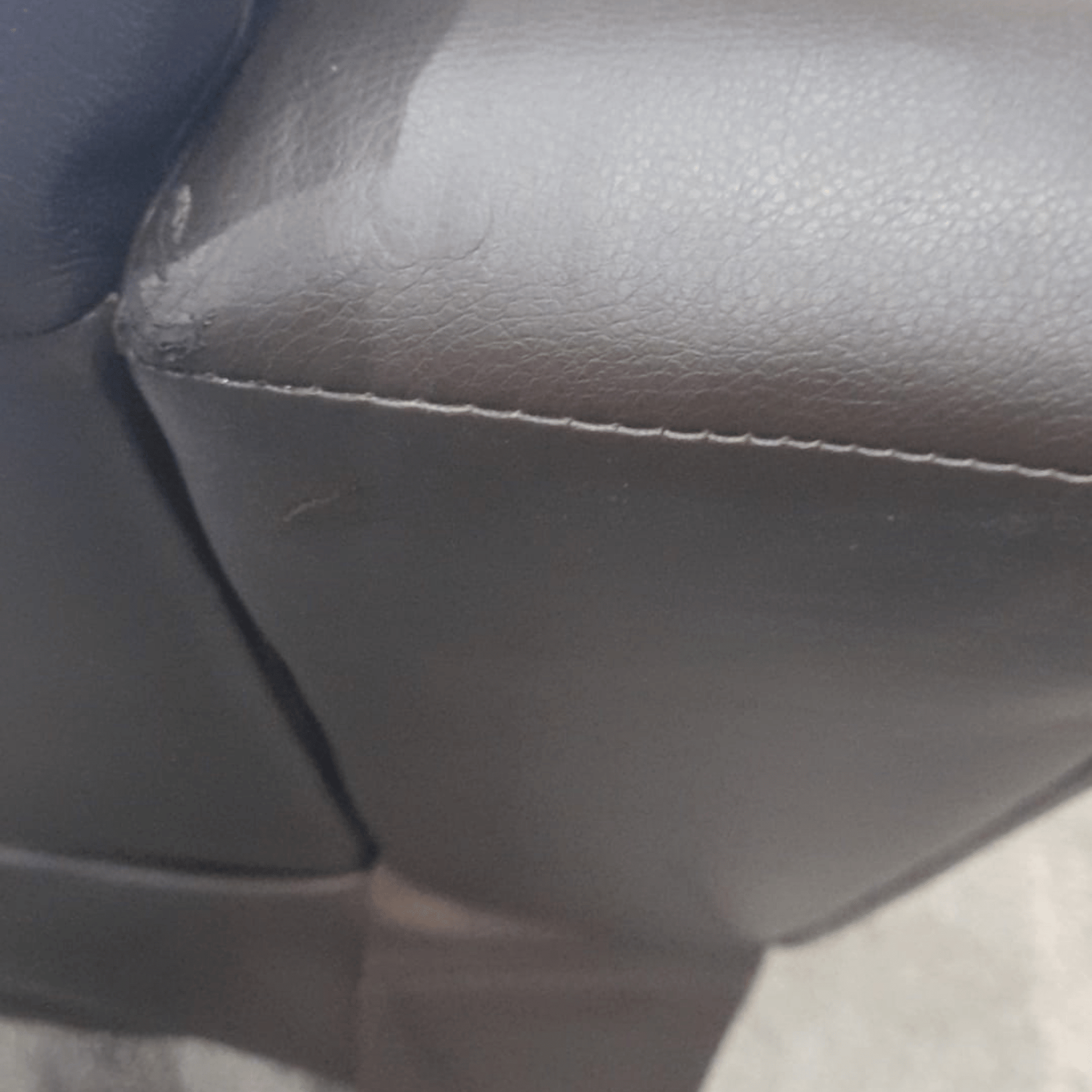 Close-up of a car seat with visible stitching
