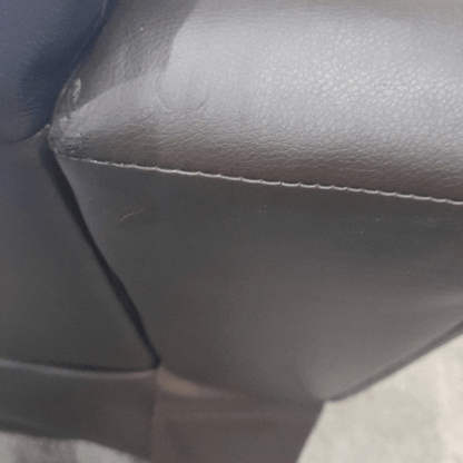 Close-up of a car seat with visible stitching