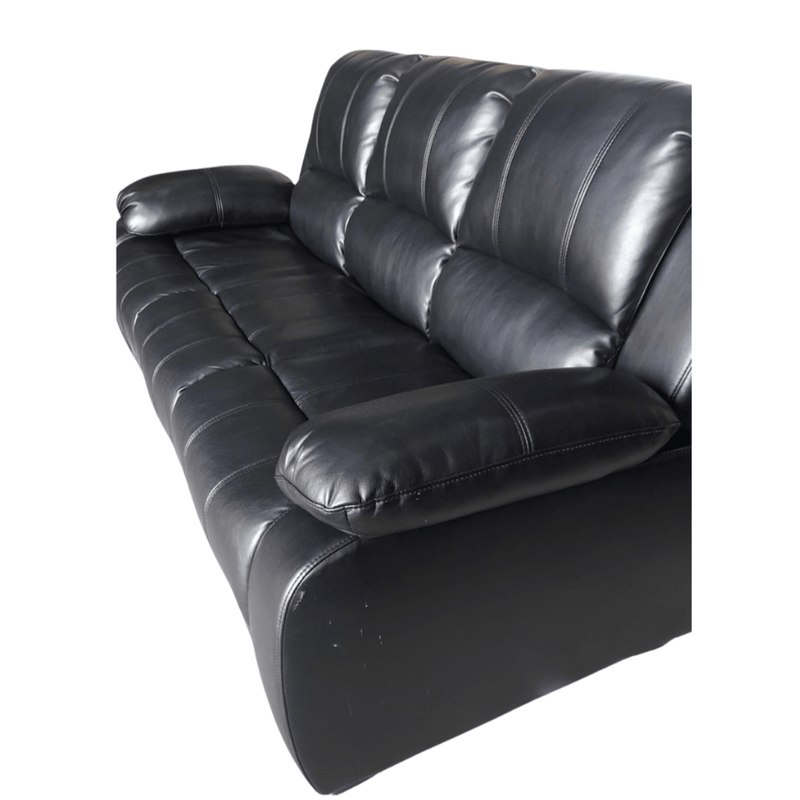 Black leather sofa on a white background