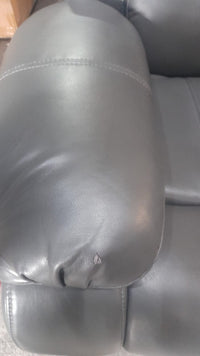 Close-up of the armrest on the Valerie grey leather 3-seater sofa, highlighting the smooth texture and stitching detail