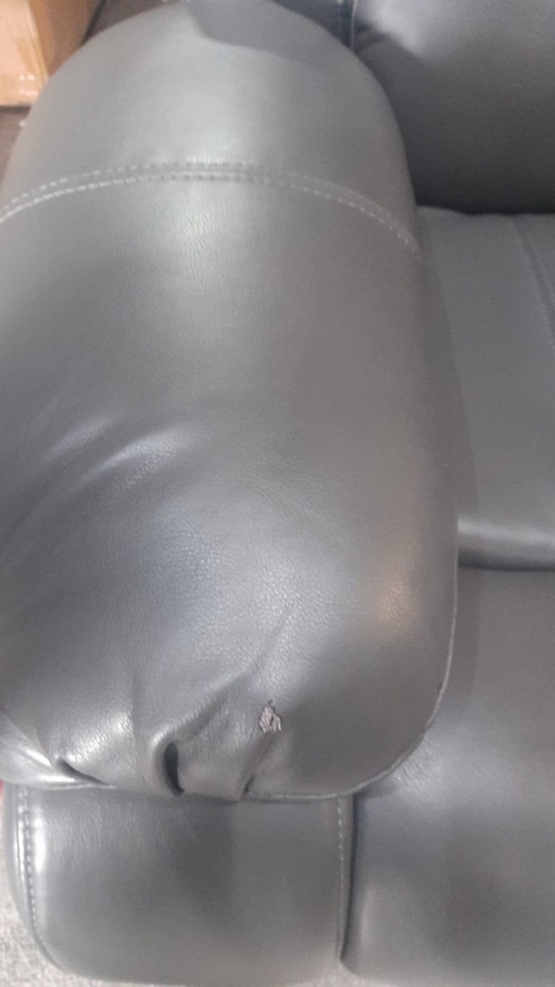 Close-up of the armrest on the Valerie grey leather 3-seater sofa, highlighting the smooth texture and stitching detail
