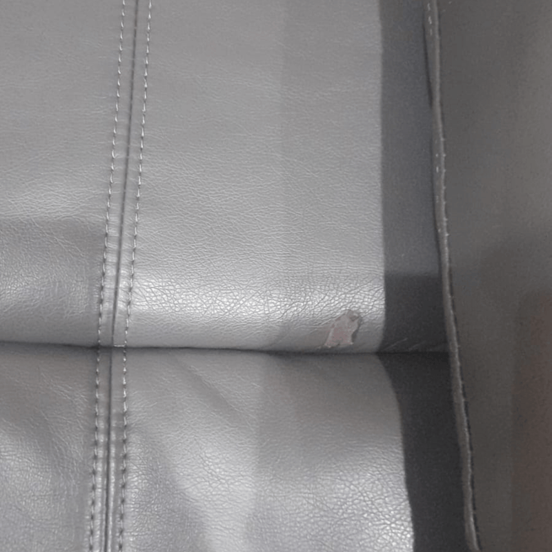  Close-up detail of the Valerie grey leather armchair showcasing texture