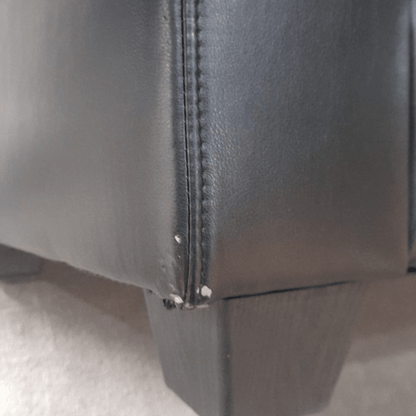 close up of Valerie black 3 seater showing scuffs