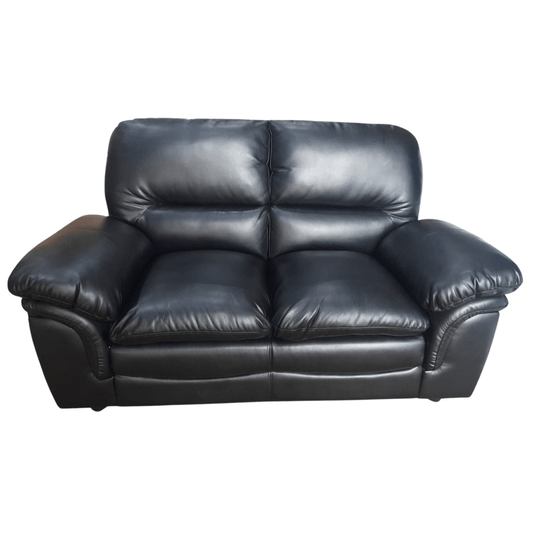 Black leather sofa on a white background
