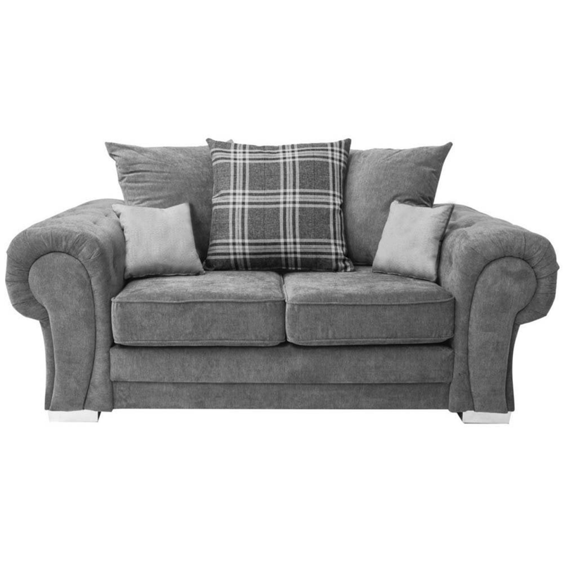 Gray sofa with plaid pillow on a white background