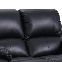 Close-up of a black leather sofa with a white background