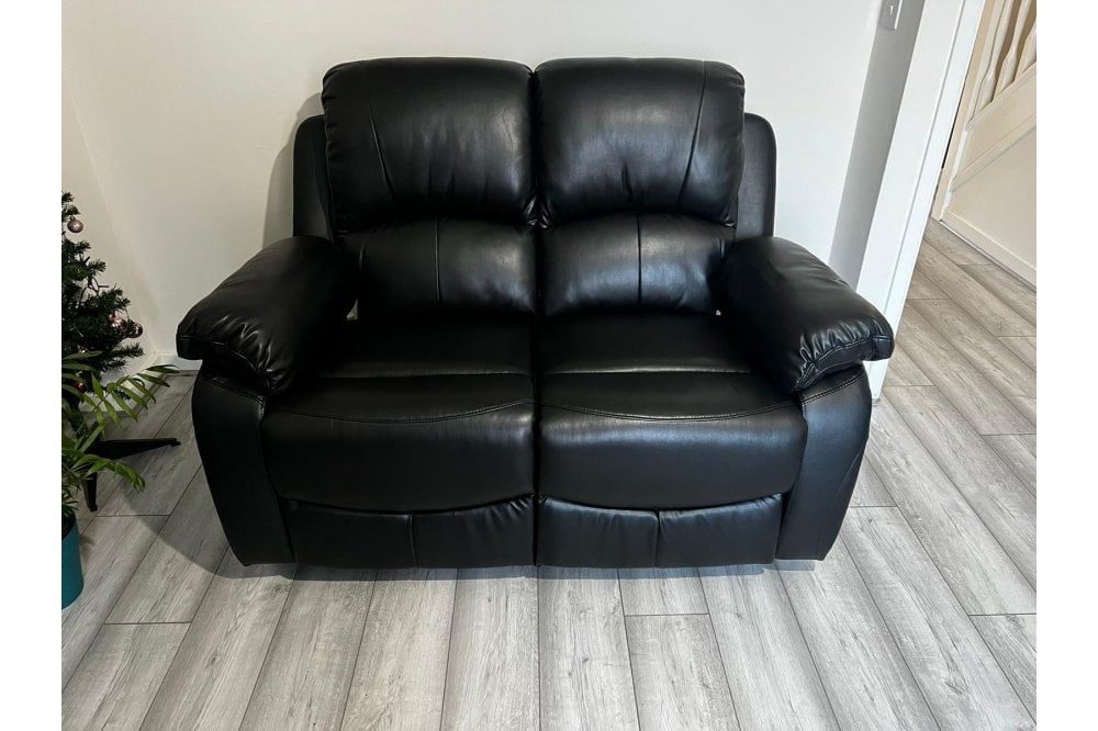 Black leather recliner 2 seater sofa in modern living room – contemporary two seater reclining couch for stylish and comfortable home interiors