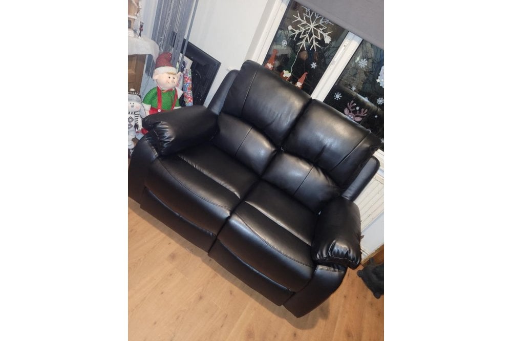 Black leather recliner 2 seater sofa in modern living room – contemporary two seater reclining couch for stylish and comfortable home interiors