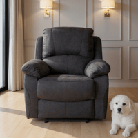 Grey armchair in a room with a white dog sitting next to it