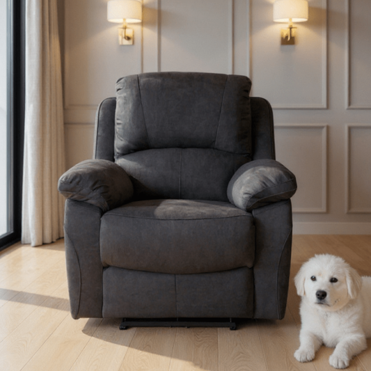 Gray armchair in a room with a white dog sitting next to it
