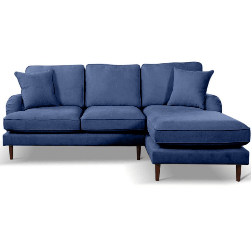 Blue sectional sofa with cushions on a white background
