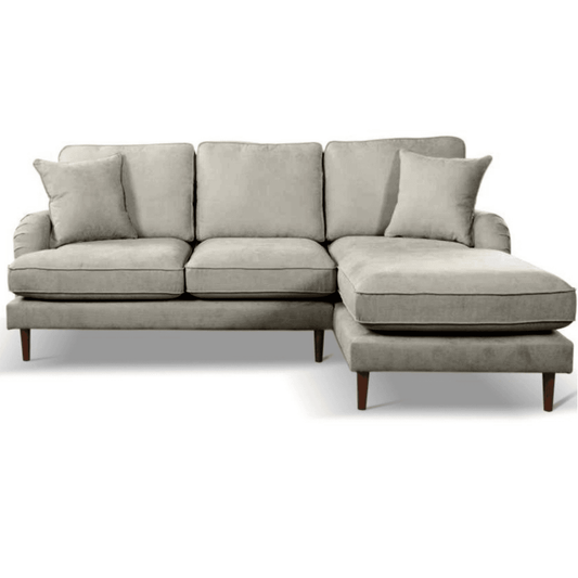 Gray sectional sofa with cushions on a white background