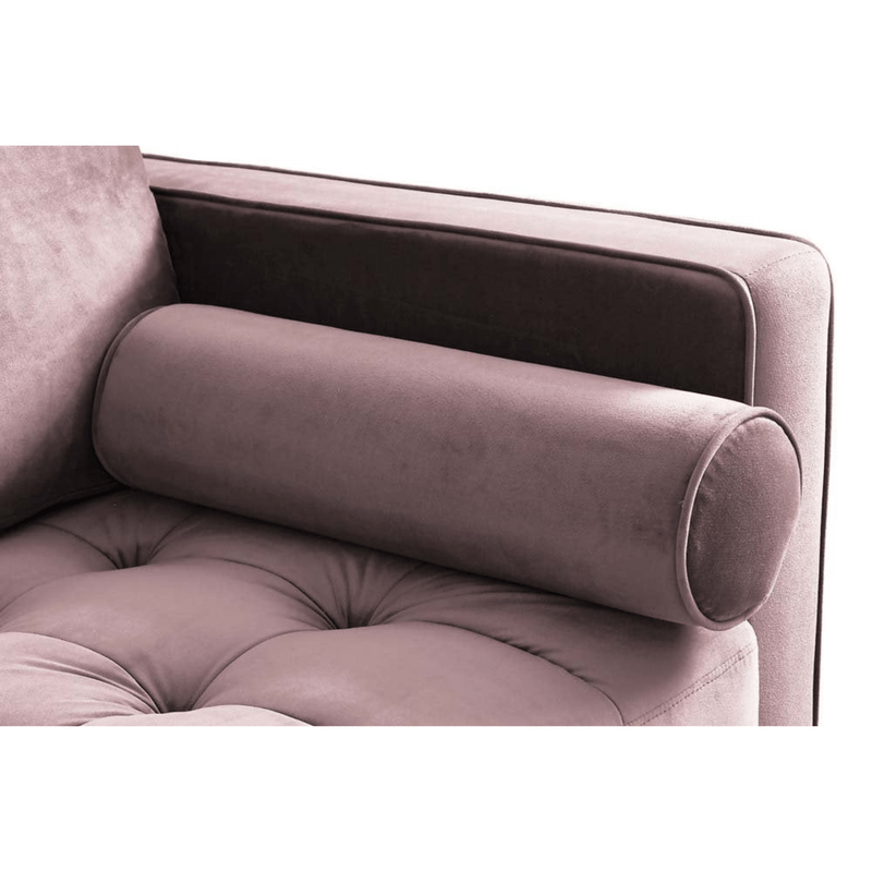 Close-up of a tufted armchair with a cylindrical backrest pillow on a white background