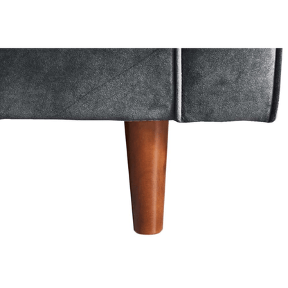 Gray upholstered chair with wooden leg on a white background